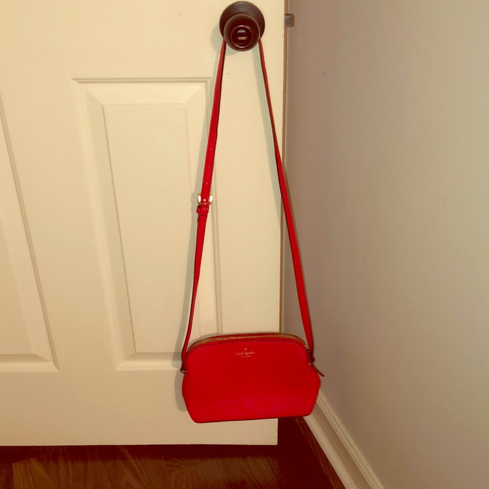 Red Kate Spade crossbody bag.